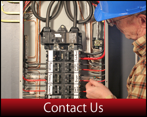 Technician Examining Fusebox - Electrical Engineering